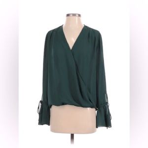 Trouve blouse with V-neck and fluted sleeves.